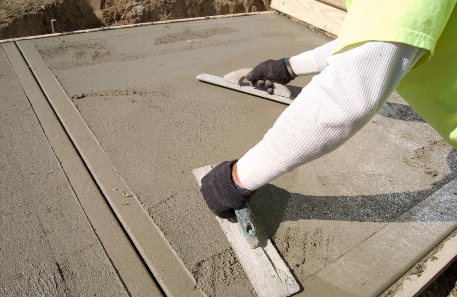 trowels are used to create a smooth-finished walkway in Tempe, AZ